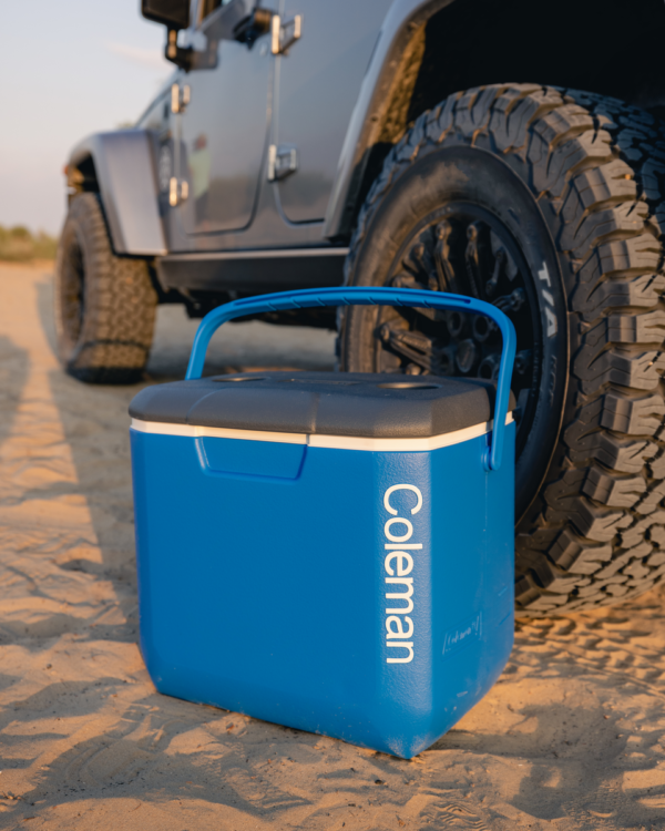 30 QT Performance Cooler by the wheel of an off-road vehicle